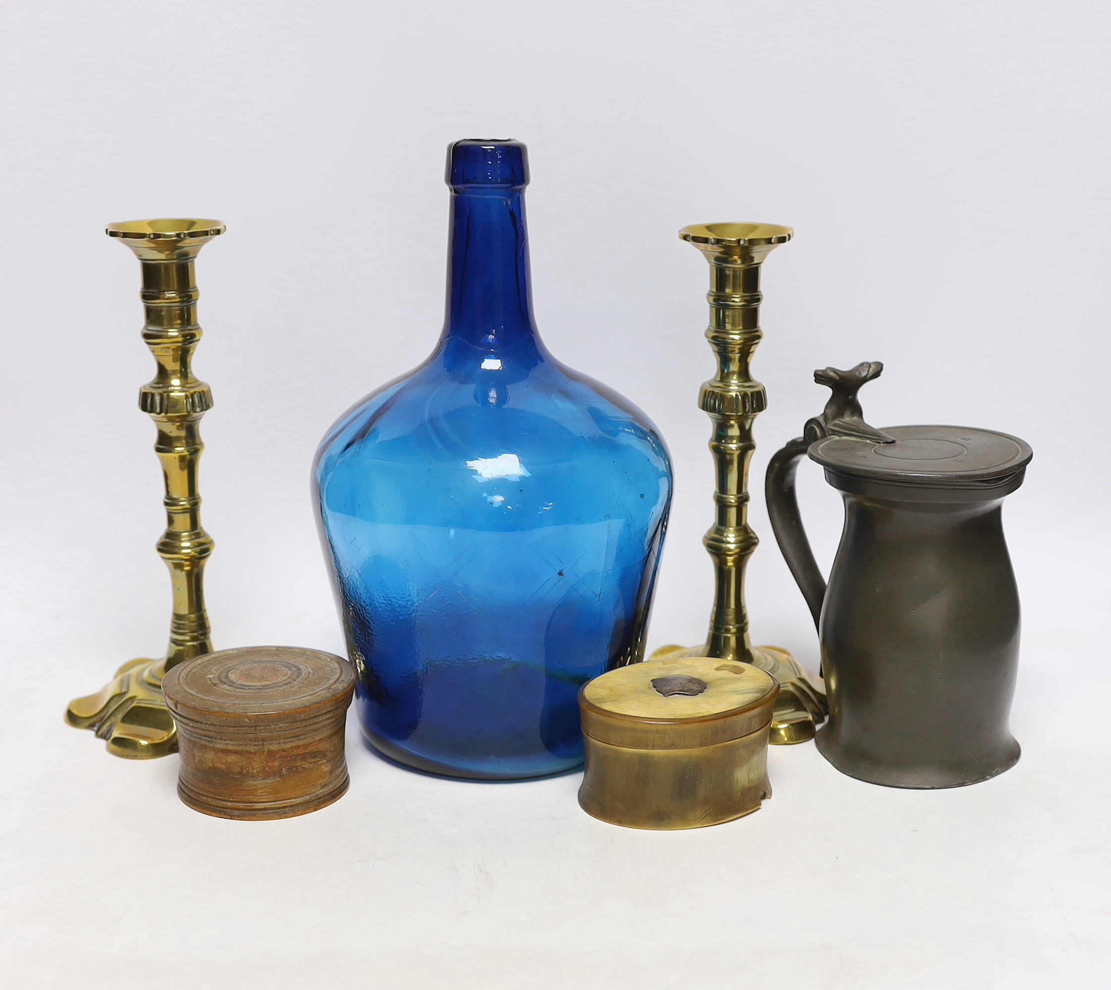 A pair of 18th century brass candlesticks, a blue glass flagon, a horn snuff box, etc. candle sticks 22cm high